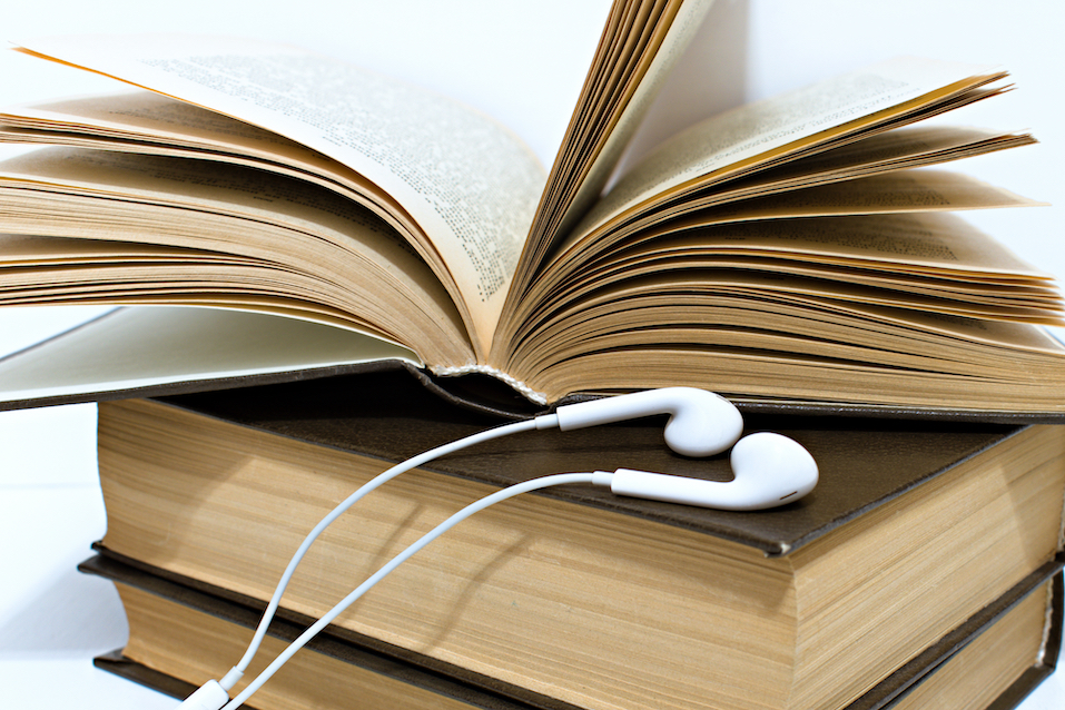 Audio,Headphones,On,Stack,Of,Old,Yellowed,Hardback,Books